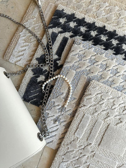 Tapis tufté main à carreaux inspiré de Chanel